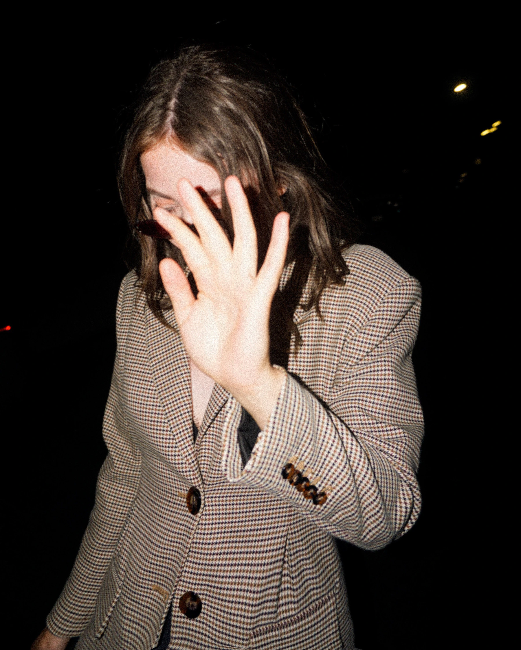 Woman covering her face